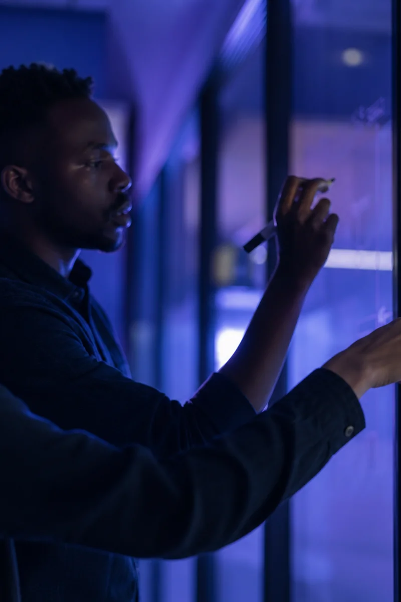 Team defining structured hiring criteria on a glass wall
